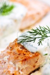 salmon-fillets-with-dill-sauce-on-white-plate
